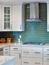 Jade green ceramics an original green farmhouse sink, in the kitchen of a greenwich village penthouse, is skirted in a ralph lauren home linen. White Kitchen With Olive Green Tile Backsplash Hgtv