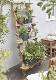 Create And Display With Your Pots By Using Steps Or A Shelving Unit Perfect For Smal Vertical Vegetable Garden Design Vegetable Garden Design Diy Garden Decor