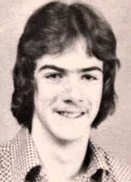 ASSISTS THE JOLLY ELF by Dave Millea Enterprise News (Cutline) BUSY WRITING  THOSE LETTERS