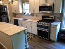 The stunning stone has a speckled pattern of light gray, beige, and brown mineral deposits. Silestone Blanco City Quartz Granite Expressions Llc Facebook