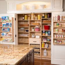 kitchen pantry with dark wood cabinets