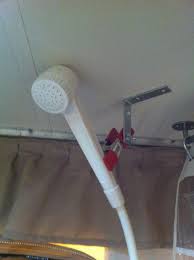 This Is Our Solution For A Shower Sprayer Ceiling Mount An L Bracket Mounted And A Clamp We Drilled A Screw Th Pop Up Camper Pop Up Tent Trailer Shower Heads