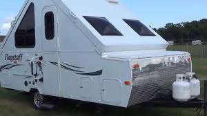 One side has a three burner range, and sink. Pre Owned 2014 Forest River T19schw Hard Side A Frame Pop Up Travel Trailer Youtube