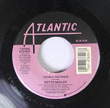 Bette midler's 1972 debut doubles as a whirlwind introduction to her sly humor and formidable voice. Bette Midler From A Distance 7 Vinyl 45 Amazon Com Music
