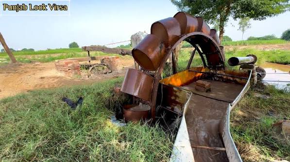 A "joara" (well) with bullocks hauling water for irrigation of fields— Agra, 1903. Restored and colorized.