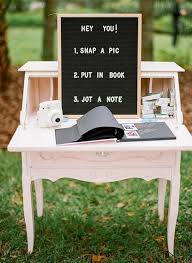 You can also have your guest hang their photos to be placed in a photo album at a later time. Polaroid Wedding Guest Book Sign In Table Decoration Ideas Emmalovesweddings