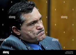 Defense attorney William Routsis reacts as District Judge Douglas Herndon  lays out his reasons for denying the motion by Darren Mack to withdraw his  pleas