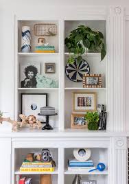 Expand the plant life in your living room or dining room space with industrial style wood and metal round wall storage or wood and brass wall shelves in fun shapes and sizes to display your greenery. 18 Effortless Ways To Style Bookshelf Decor Better Homes Gardens