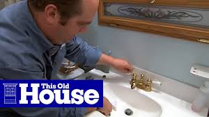 Clean and reassemble the faucet head. How To Replace A Faucet Aerator This Old House Youtube