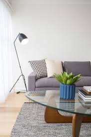 Known for its freeform sculptural base and glass tabletop, this replica similarly features thick tempered glass and stained wooden legs. Property Styling In Hobart Home Styling Packages Hobart Decoracion Living Decoracion De Unas Living