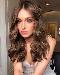 Beautiful girl brown hair, smiling outdoors holding hands behind his head. 40 Hot Brown Hair Color Ideas 2019 Page 12 Of 45 Veguci Light Golden Brown Hair Golden Brown Hair Color Brown Ombre Hair