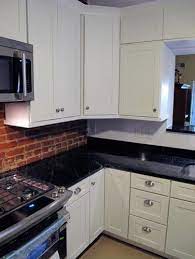 The rustic brick backsplash in this kitchen by jennifer johnson almost looks too good to be true. Bo Jeffares Jobeffares Profile Pinterest