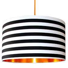 White lamp shades allow the greatest amount of light to shine through, while darker shades give a more nuanced light that can impact the mood of a room. Black And White Lamp Shades The Monochrome Trend Love Frankie