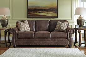 The benchcraft breville sofa updates your space with elegant style with nailhead trim and rolled faux leather upholstery is soft and easy to clean. Breville 90 Faux Leather Sofa Sofas And Sectionals