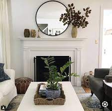 Mirrors add depth and reflect attractive for safety, check that there's no risk of mirrors falling over or falling down during a natural disaster a round mirror on a stand in front of a rectangular mirror with pillar candles in groups of three in front. Black Circle Mirror Mantle Decor Fireplace Mantle Decor Living Room Green Fireplace Mantel Decor