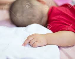 Asian Baby Sleeping On The Bed With Middle Finger Stock Photo Picture And Royalty Free Image Image 40195470