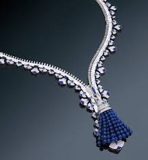 Lotus openwork pendant mini model white gold, diamond $ 5,450 tax excl. Behind The Van Cleef Arpels Zip Necklace