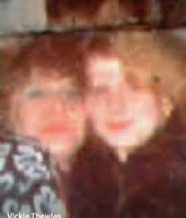 Please is there any one who could make this clearer for us , its the first  pic of myself and my husband over 30 yrs ago and would be so grateful to