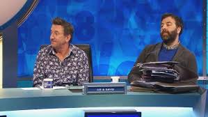 Brett domino is in dictionary corner. 8 Out Of 10 Cats Comedian Guests