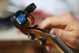 Fine tuning each violin string to match the reference tone (well at least very close to matching). A Guide To Violin Tuning Superprof
