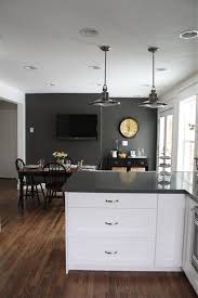 Deep gray walls offer a rich contrast to simple white cabinets and millwork, while allowing silver fixtures to shine, just as we saw in andi and dean's san francisco kitchen. A Transition From A Traditional To A Stylish Modern Kitchen Gray Accent Wall Kitchen Grey Kitchen Walls Accent Wall In Kitchen