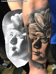 An almond branch with flowers inked on her back looking very striking. Tattoo Of Faces Flowers Forearm