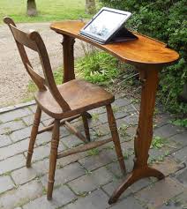 The banquette bench opens to reveal hidden storage. Kidney Shaped Pedestal Mahogany Reading Table