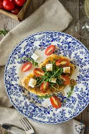 Panko chicken breast with arugula and provolne / quinoa crusted schnitzel with creamed corn gnocchi. Chicken Milanese With Arugula Tomatoes And Fresh Mozzarella The Beach House Kitchen