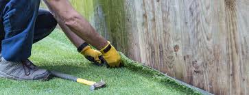 Using a wheelbarrow or shovel, scatter your base material. How To Lay Artificial Turf