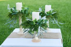 This wedding centerpiece only requires a few flowers. How To Make Diy Rustic Candle Holder Wedding Centerpieces