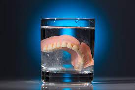 Place two teaspoons of baking soda into a glass and add a few drops of water. How To Clean Whiten Your Dentures L Mile High Dental Implant Centers