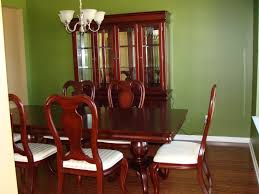 Large green dining room with leather chairs and large windows. Green Dining Room Decoration Designs Guide
