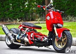 honda zoomer x turbo form small scooter body is extended rather large rear wheels and red paint p custom honda ruckus harley bikes scooter bike