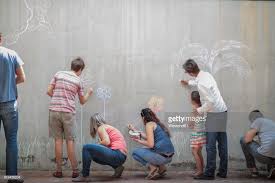 People Drawing Colourful Pictures With Chalk On A Concrete Wall Drawing People Colorful Pictures Concrete Wall