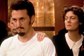 Image of RELATIVE OF REBEL ROLY ROJAS POSED WITH T-SHIRT AND PHOTOS,