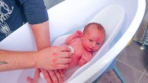 Bear in mind that the emollient will make your baby slippery to handle. Baby S First Bath At Home Youtube