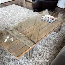 Taking old salvaged doors and repurposing them is a really cool way to add some interest to a room. Repurpose An Old Barn Door Into A Table Door Coffee Tables Barn Door Tables Old Barn Doors