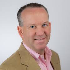 I saw a man holding this sign at mile marker nine. My wife, son and  daughter are runners. Me? Not so much. My family was relentless in  encouraging me to run a