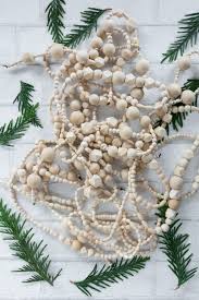 Wood bead garland christmas tree. How To Make A Stunning Simple Diy Wood Bead Christmas Garland