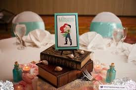 Tables Themed As Different Disney Movies So Basically My Wedding Idea Nice To Little Mermaid Wedding Disney Centerpieces Disney Fairy Tale Weddings