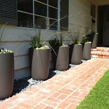 Metal planters have a unique charm and look. Geisha Contemporary Tall Outdoor Planter Pot Round Stardust
