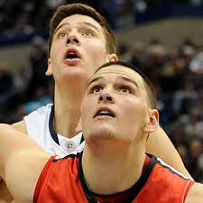 Ryan Olander blocks brother Tyler Olander's shot then dunks