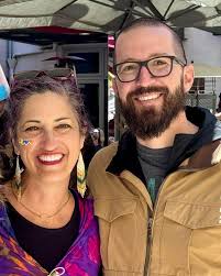 We are the proud, loving, supportive parents of a queer transgender child.  An old friend snapped this pic of Ben and I at the Santa Cruz Pride parade 