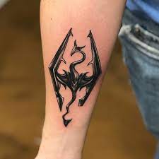 The dragon skyrim tattoo is an amazing choice for those people who like large tattoos. 101 Amazing Skyrim Tattoo Ideas That Will Blow Your Mind Skyrim Tattoo Scroll Tattoos Tattoos