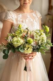 Select from premium yellow wedding bouquet of the highest quality. Premium Photo Wedding Rings For Bride And Groom On Bouquet Of Blue Fresh Flowers
