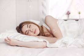 Maybe you would like to learn more about one of these? An Attractive Young Girl In White Pajamas Is Lying With Her Eyes Stock Photo Picture And Royalty Free Image Image 148586007