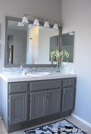 With a 220 grit sand pad , i light sanded the primed 24 update ideas to make your kitchen look fabulous. How To Paint Oak Cabinets Painting Bathroom Cabinets Painted Bathroom Bathroom Makeover