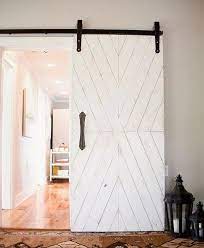 12 Beautiful Ways To Decorate With Barn Doors In Your Home Barn Door Designs Farmhouse Doors Doors