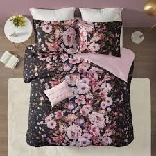 Doodled circles create this look with pops of pink, teal, purple and black while a teal polka dot reverse plays up the back. Full Queen Jessica Floral Printed Comforter Set Black Target