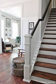 The white walls contrast with the striking dark railing. Pin On Home Decor